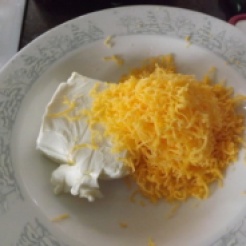 Step 1: Combine cream cheese and cheddar cheese.